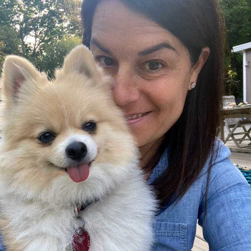 Mia and her dog; Luxury diamond fine jewelry by Sweet Mia Jewels.