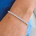 Continuum lab-grown diamond tennis bracelet in 14K gold featuring a continuous line of round diamonds worn on the wrist.